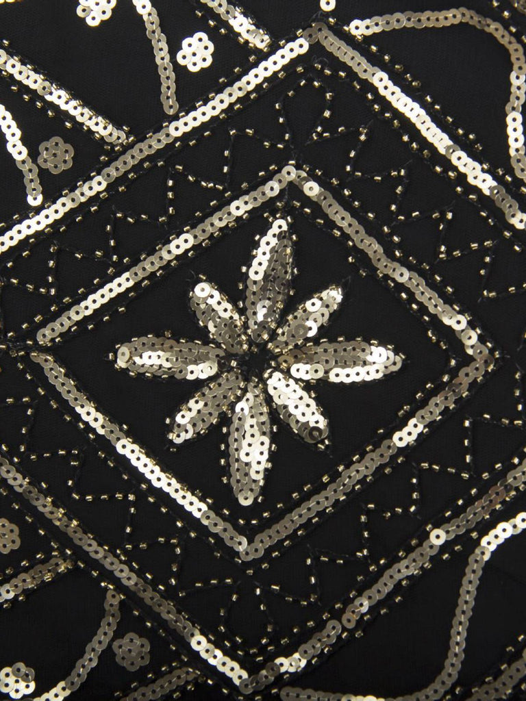 This 1920s Gatsby Sheer Neck Tassel Sequins Dress wraps her in 1920s elegance, one twirl at a time