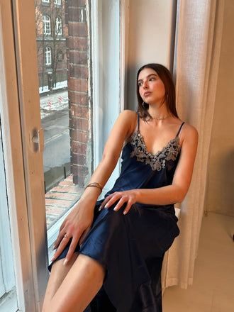 She slips into this 1930s Embroidered Faux Satin S