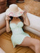 She's wearing 1930s Plaid Halter One-Piece Swimsuit and the whole beach remembers the 1930s