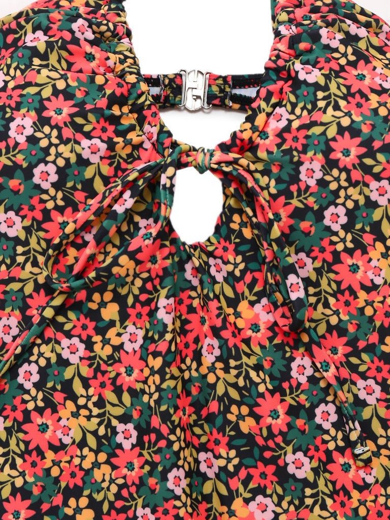 This 1930s Spaghetti Strap Ditsy Floral One-Piece Swimsuit carries 1930s vacation dreams in every stitch