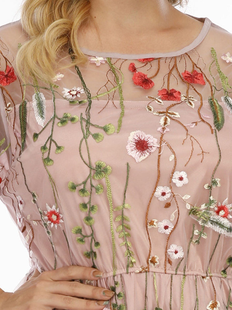 This 1940s Floral Embroidered Mesh Dress wraps her