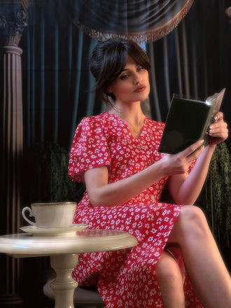 She slips into this 1940s Floral V-Neck Added Button Dress and suddenly it's a 1940s daydream