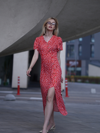 She slips into this 1940s Floral V-Neck Added Button Dress and suddenly it's a 1940s daydream