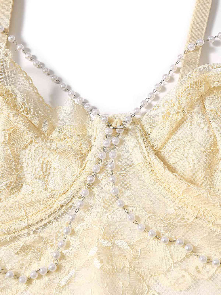 She pairs this 1940s Chain Floral Lace Crop Camisole with confidence and 1940s charm