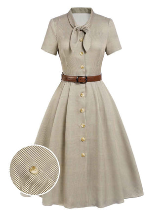 She slips into this 1940s Small Windowpane Plaid Dress and suddenly it's a 1940s daydream