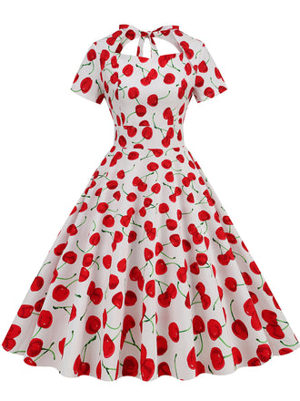 She slips into this 1950s Cherry Sweetheart Short Sleeve Lace Up Dress and suddenly it's a 1950s daydream