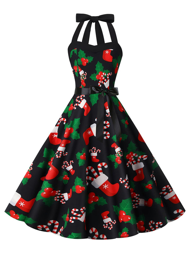 She slips into this 1950s Christmas Halter Belted Swing Dress and suddenly it's a 1950s daydream