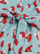 1950s Christmas Santa & Elk Print Swing Dress — the kind of 1950s dress that makes strangers smile