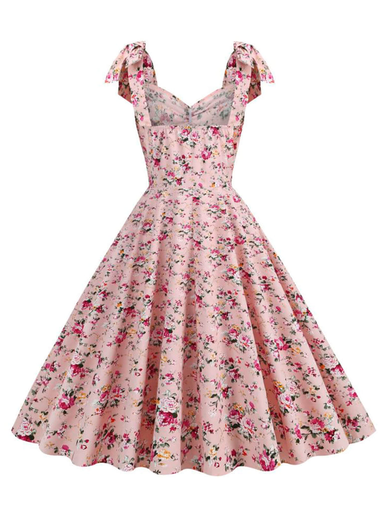 This 1950s Ditsy Floral Tie Swing Dress wraps her in 1950s elegance, one twirl at a time