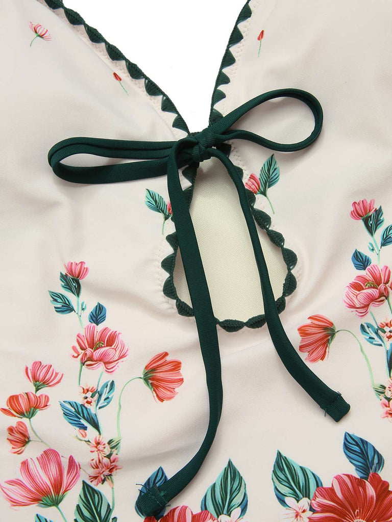 She's wearing 1950s Floral Print Spaghetti Strap One-Piece Swimsuit and the whole beach remembers the 1950s