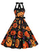 1950s Halloween Pumpkin Face Halter Dress — the kind of 1950s dress that makes strangers smile