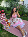 She slips into this 1950s Halter Floral Swing Dress and suddenly it's a 1950s daydream