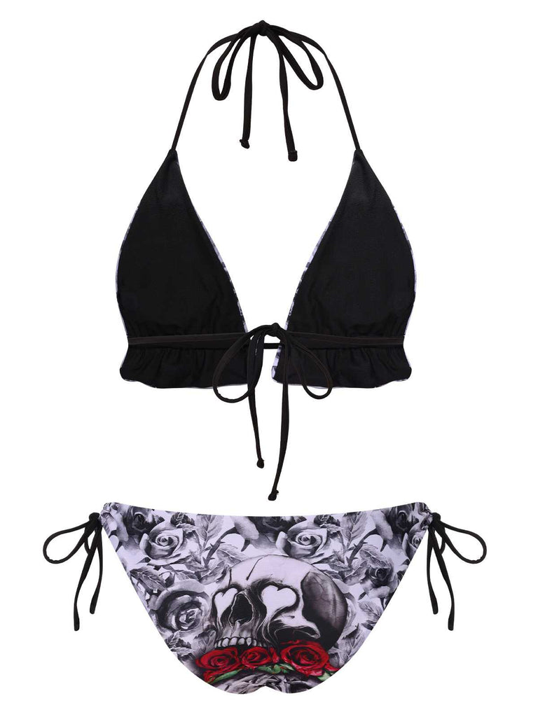 This 1950s Halter Gothic Skull Roses Swimsuit carries 1950s vacation dreams in every stitch