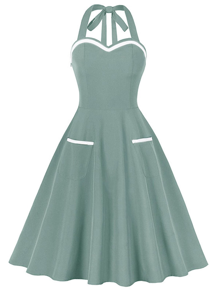 1950s Halter Pockets Backless Swing Dress — a 1950s silhouette that turns sidewalks into runways