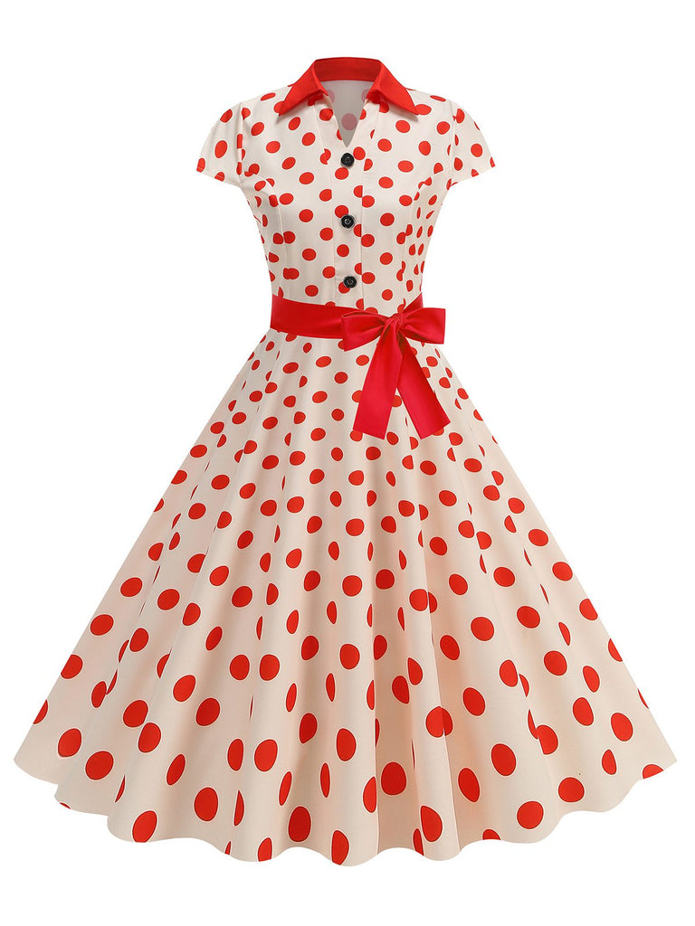 This 1950s Lapel Polka Dots Bow Swing Dress wraps her in 1950s elegance, one twirl at a time
