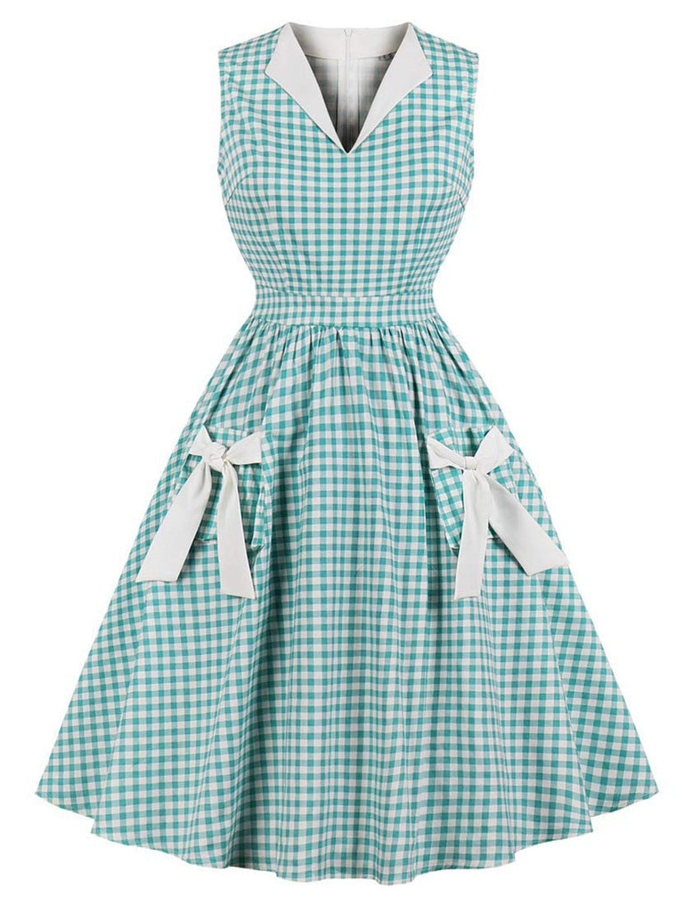 She slips into this 1950s Plaid Bow Pockets Lapel Dress and suddenly it's a 1950s daydream