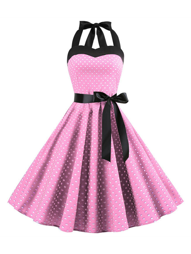 She slips into this 1950s Polka Dot Bow Tie Halter Swing Dress and suddenly it's a 1950s daydream