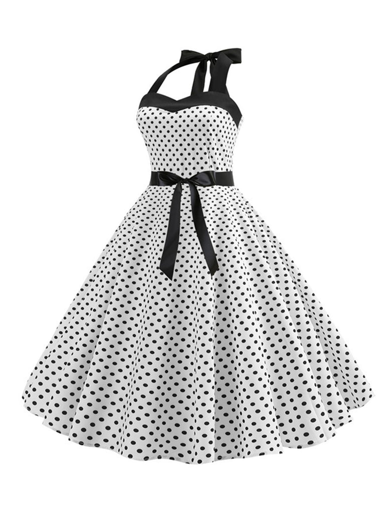 This 1950s Polka Dot Bow Tie Halter Swing Dress wraps her in 1950s elegance, one twirl at a time