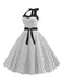 This 1950s Polka Dot Bow Tie Halter Swing Dress wraps her in 1950s elegance, one twirl at a time