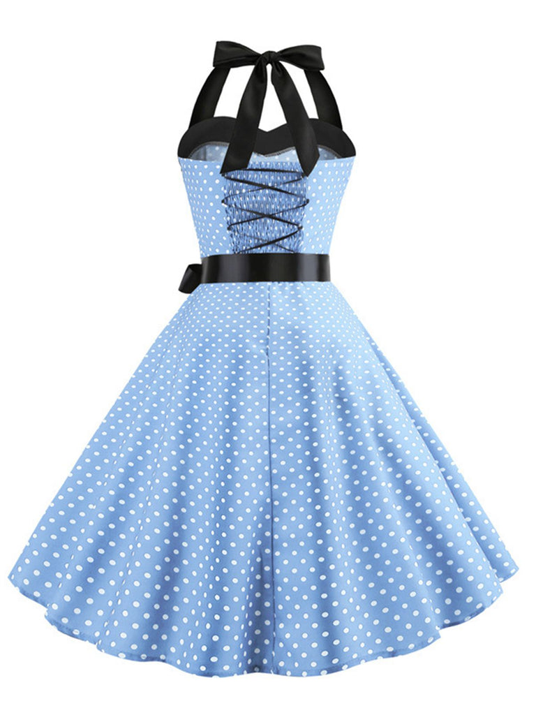 This 1950s Polka Dot Bow Tie Halter Swing Dress wraps her in 1950s elegance, one twirl at a time