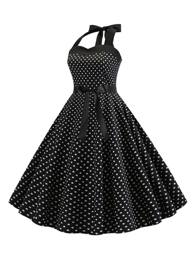 She slips into this 1950s Polka Dot Bow Tie Halter Swing Dress and suddenly it's a 1950s daydream