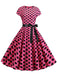 She slips into this 1950s Polka Dot Cap Sleeved Dress and suddenly it's a 1950s daydream