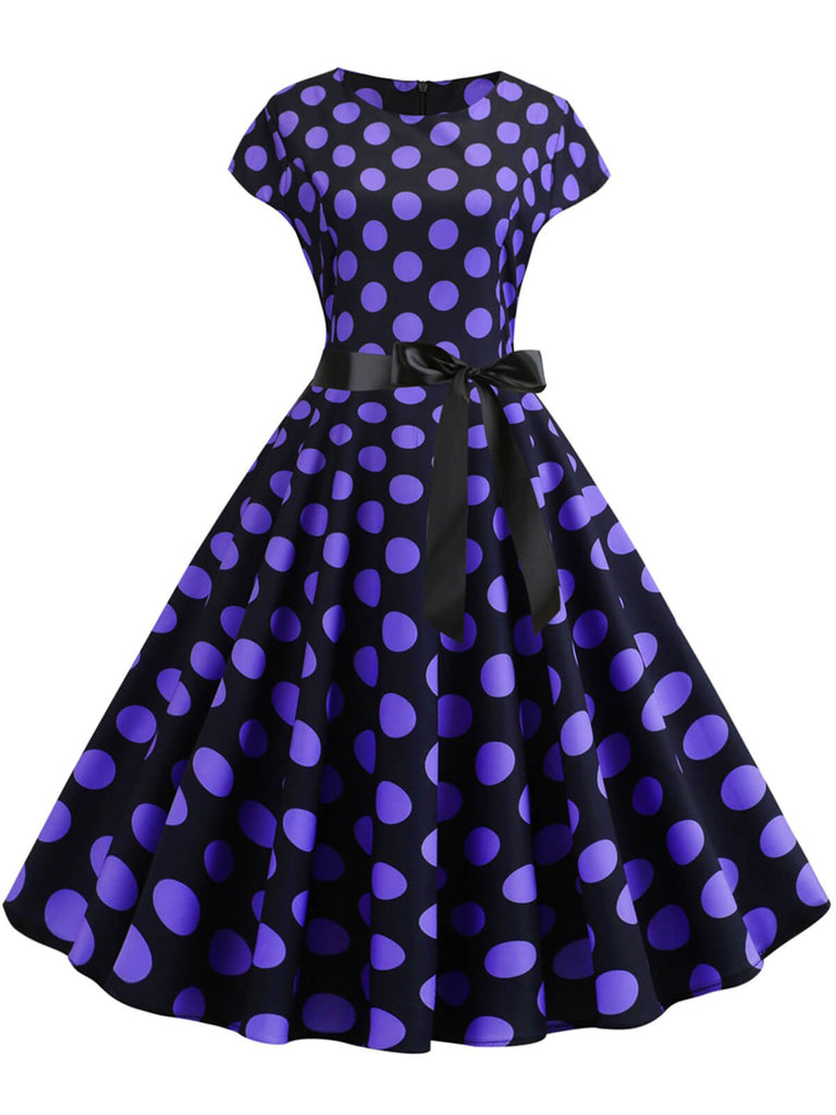 She slips into this 1950s Polka Dot Cap Sleeved Dress and suddenly it's a 1950s daydream