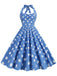 She slips into this 1950s Polka Dot Halter Swing Dress and suddenly it's a 1950s daydream