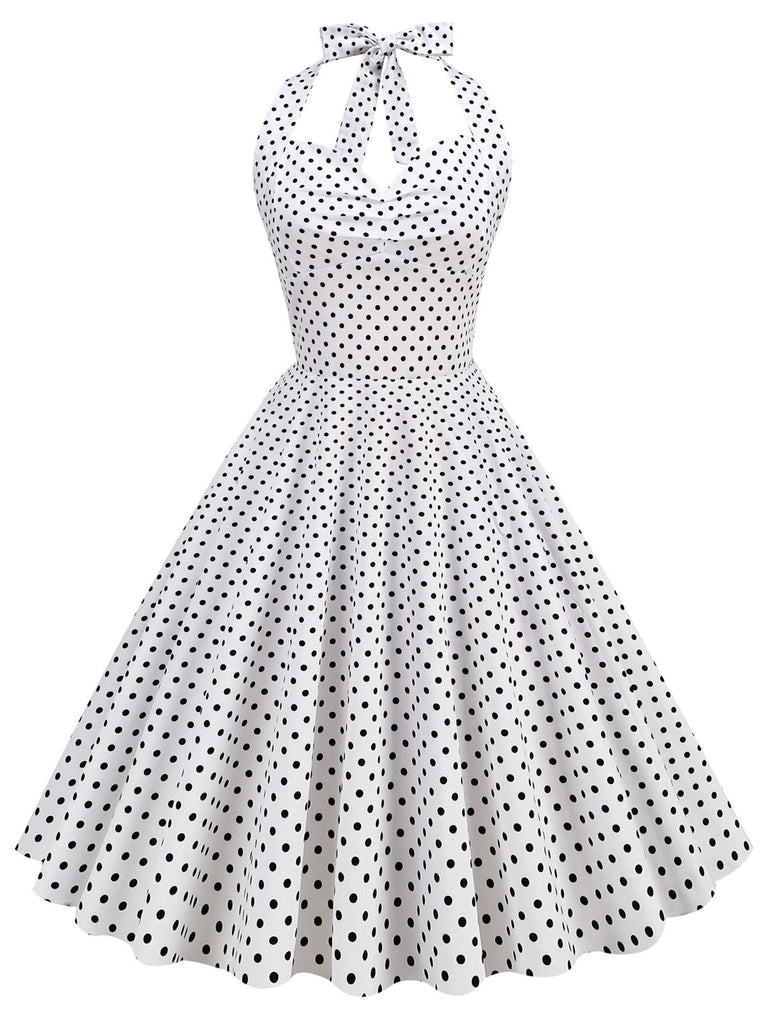 She slips into this 1950s Polka Dots Lace Up Halter Swing Dress and suddenly it's a 1950s daydream