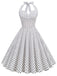 She slips into this 1950s Polka Dots Lace Up Halter Swing Dress and suddenly it's a 1950s daydream