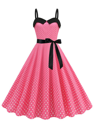 She slips into this 1950s Polka Dots Patchwork Ribbon Strap Dress and suddenly it's a 1950s daydream