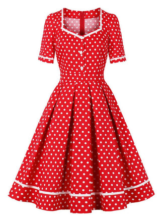She slips into this 1950s Polka Dots Patchwork Swing Dress and suddenly it's a 1950s daydream