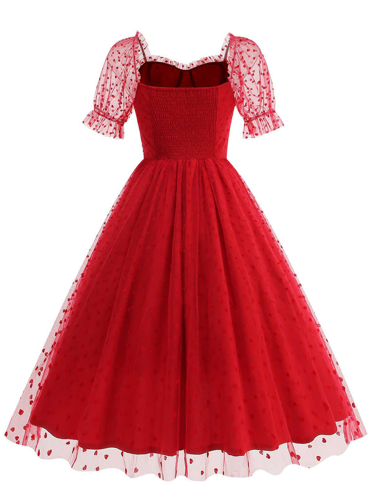 She slips into this 1950s Puff Sleeve Valentine Heart Mesh Dress and suddenly it's a 1950s daydream