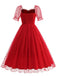 She slips into this 1950s Puff Sleeve Valentine Heart Mesh Dress and suddenly it's a 1950s daydream