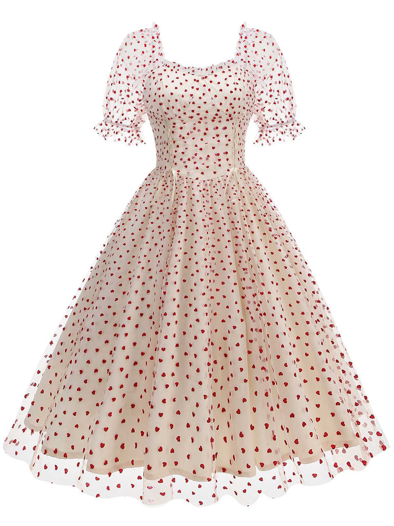 This 1950s Puff Sleeve Valentine Heart Mesh Dress wraps her in 1950s elegance, one twirl at a time