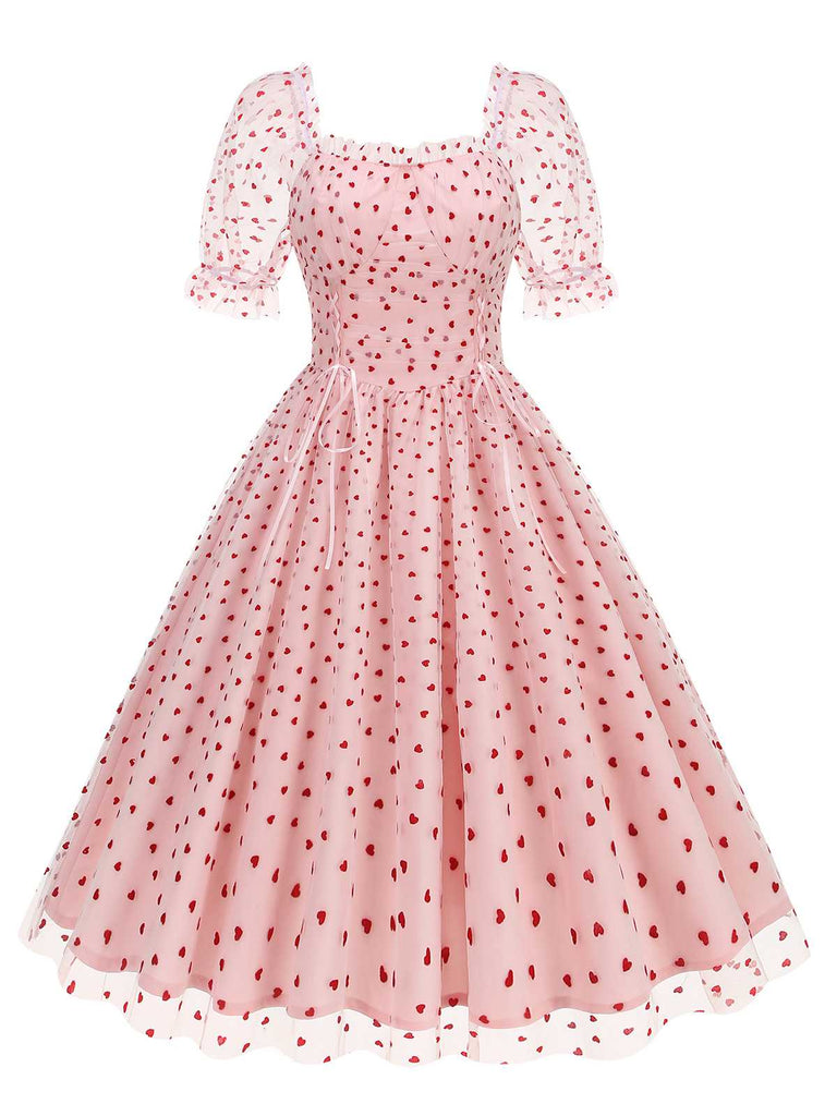 She slips into this 1950s Puff Sleeve Valentine Heart Mesh Dress and suddenly it's a 1950s daydream