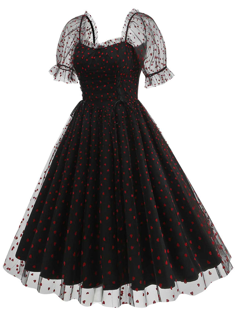 She slips into this 1950s Puff Sleeve Valentine Heart Mesh Dress and suddenly it's a 1950s daydream