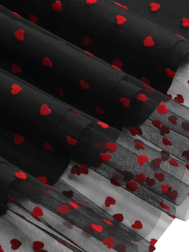 This 1950s Puff Sleeve Valentine Heart Mesh Dress wraps her in 1950s elegance, one twirl at a time