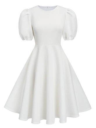 She slips into this 1950s Round Neck Puff Sleeve A-Line Dress and suddenly it's a 1950s daydream