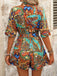 She pairs this 1950s Shirt Neck Print Belted Romper with confidence and 1950s charm