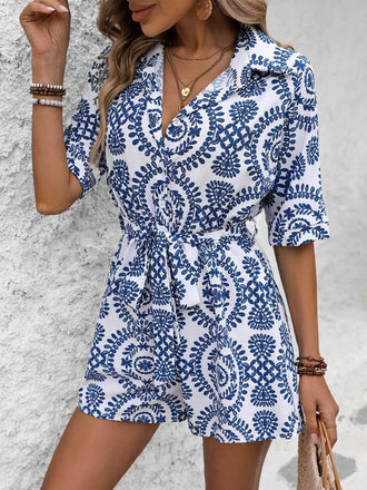 She pairs this 1950s Shirt Neck Print Belted Romper with confidence and 1950s charm