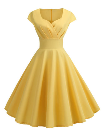 She slips into this 1950s Solid Heart Neck Short Sleeve Dress and suddenly it's a 1950s daydream