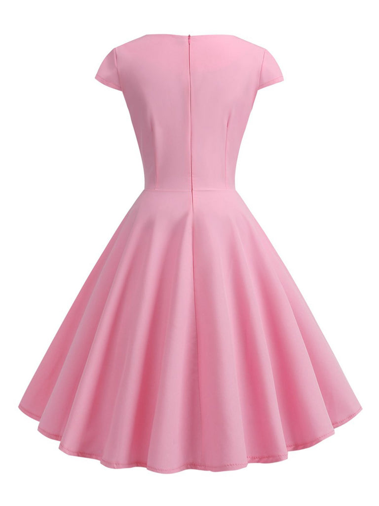 This 1950s Solid Heart Neck Short Sleeve Dress wraps her in 1950s elegance, one twirl at a time