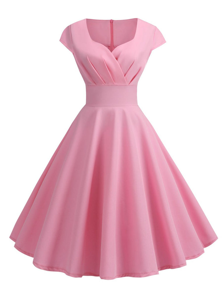 She slips into this 1950s Solid Heart Neck Short Sleeve Dress and suddenly it's a 1950s daydream