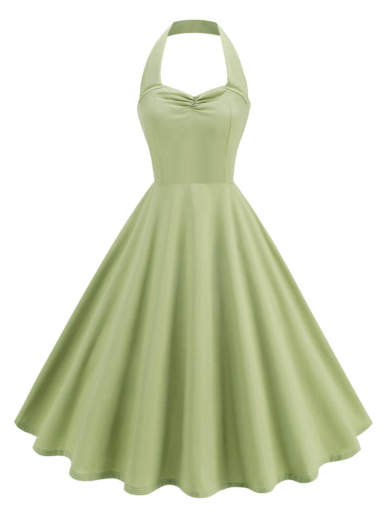She slips into this 1950s Solid Sweetheart Neck Halter Dress and suddenly it's a 1950s daydream