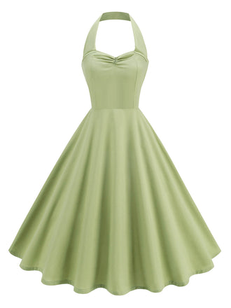 She slips into this 1950s Solid Sweetheart Neck Halter Dress and suddenly it's a 1950s daydream
