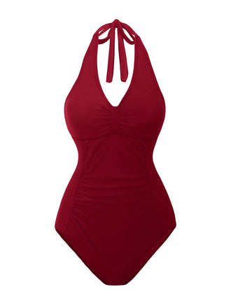 She's wearing 1950s Solid V-Neck Ruched Halter One-Piece Swimsuit and the whole beach remembers the 1950s