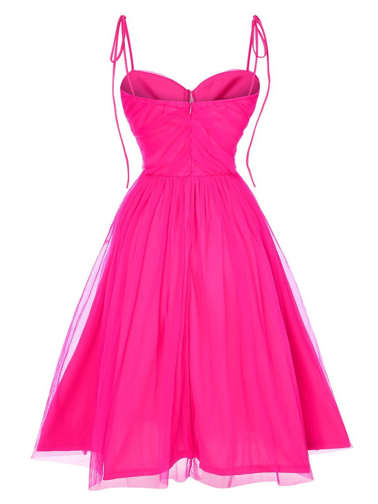 This 1950s Spaghetti Strap Solid Mesh Dress wraps her in 1950s elegance, one twirl at a time