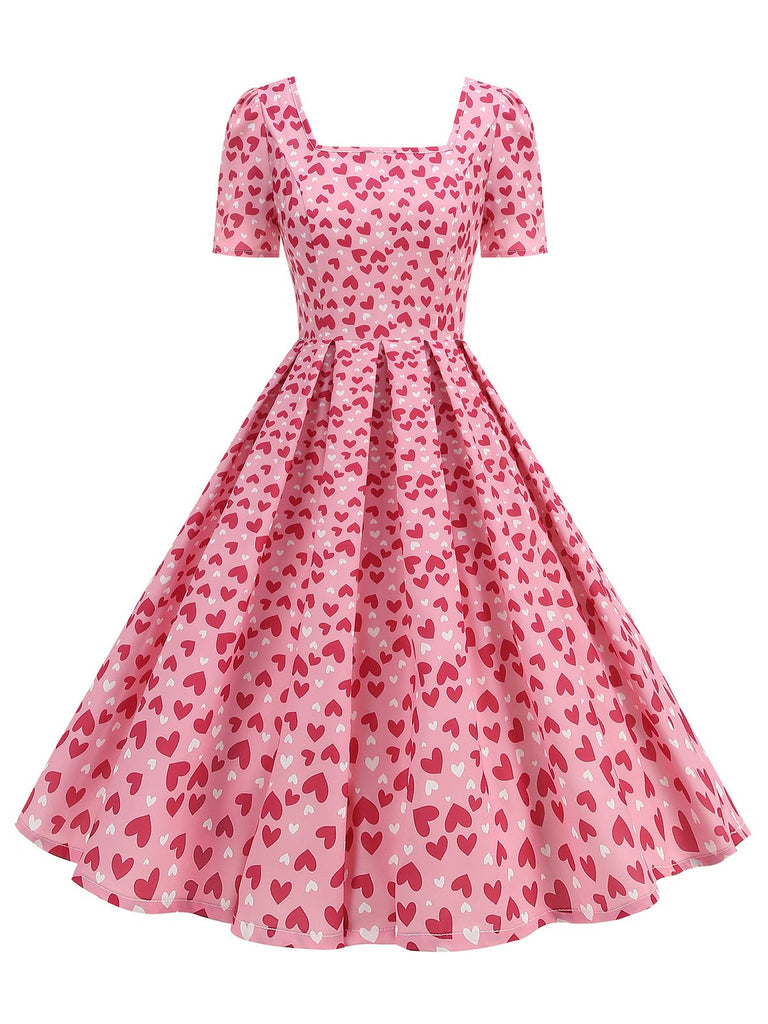 This 1950s Square Neck Heart Dots Dress wraps her in 1950s elegance, one twirl at a time