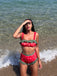 She's wearing 1950s Strawberry Ruffle Strap Swimsuit and the whole beach remembers the 1950s